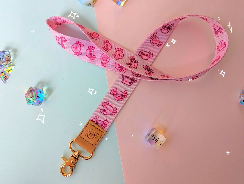 Axolotl Lanyard with various artworks of axolotls, confused axolotl, happy axolotl, shy axolotl, minecraft inspired axolotl, aaaaa axolotl and e_e axolotl